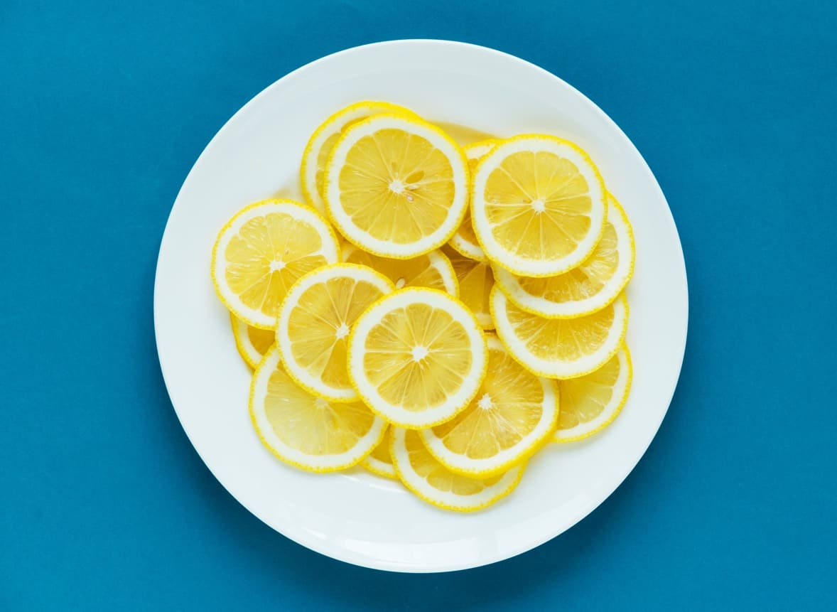 Lemon in a plate with blue background