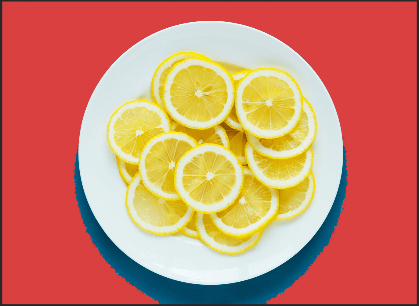 Lemon in a plate with red background