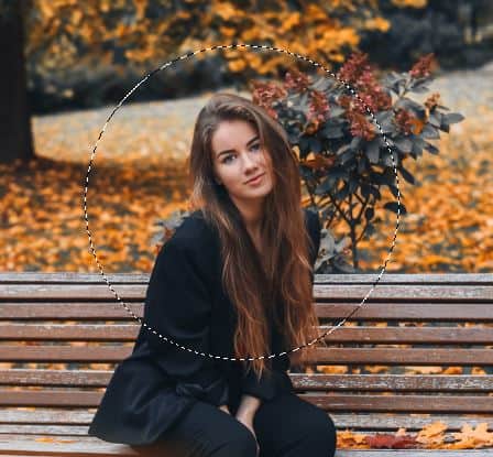 circular selection around woman face during autumn