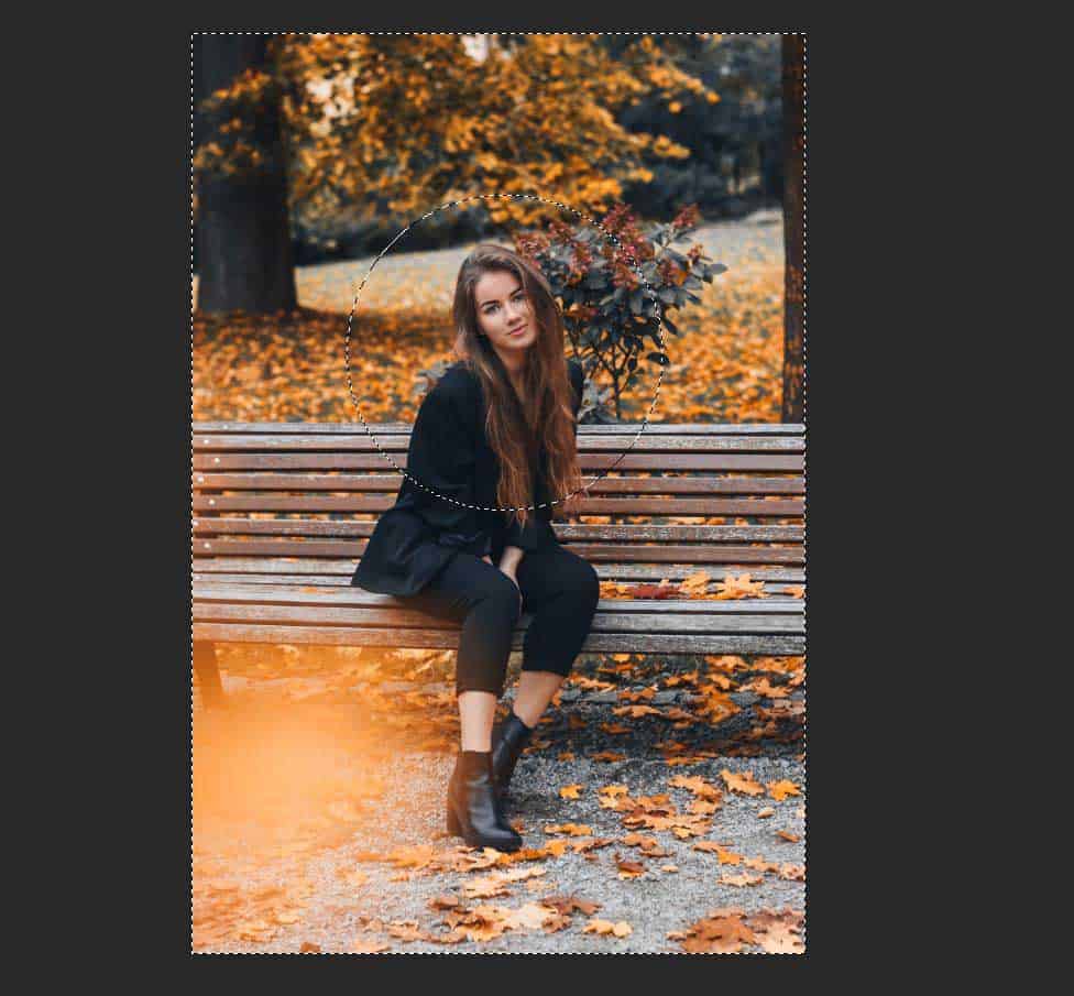 women sitting on a bench in autumn