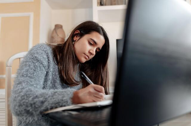 woman learning online with a laptop